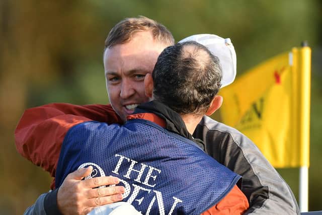 Graeme Robertson celebrates with his caddie after securing the last of four spots up for grabs at Dundonald Links at the fifth hole in a play-off. Picture: Mark Runnacles/R&A/R&A via Getty Images.