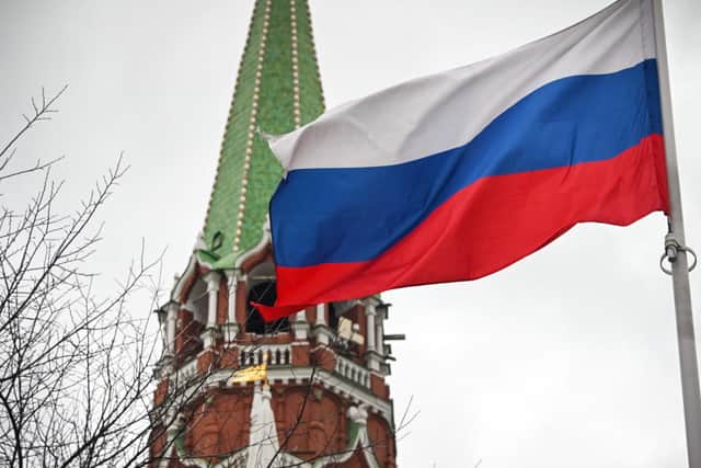 A Russian flag waves next to one of the Kremlin towers in downtown Moscow on February 26, 2022. Angus Robertson, Cabinet Secretary for the Constitution, External Affairs and Culture at the Scottish Government, has called for Russia to end the "illegal act of aggression" against its neighbour. (Photo by Alexander NEMENOV / AFP) (Photo by ALEXANDER NEMENOV/AFP via Getty Images)