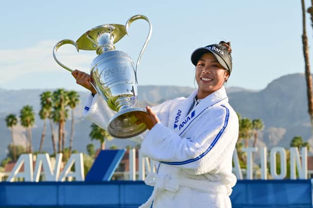 Patty Tavatanakit holds aloft the trophy after completing a wire-to-wire win in the 50th edition of the ANA Inspiration in California. Picture: Gabe Roux
