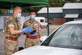 Nearly 100 soldiers, mainly from the Royal Scots Dragoon Guards, are being deployed by the British Army to help set up 80 new vaccination centres across Scotland