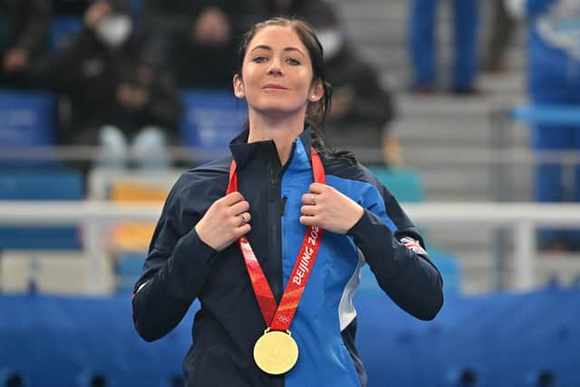 Gold medallist Eve Muirhead poses on the podium during the women's curling victory ceremony at the Beijing 2022 Winter Olympic Games. (Photo by LILLIAN SUWANRUMPHA/AFP via Getty Images)