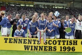 Rangers players celebrate winning the 1996 Scottish Cup.