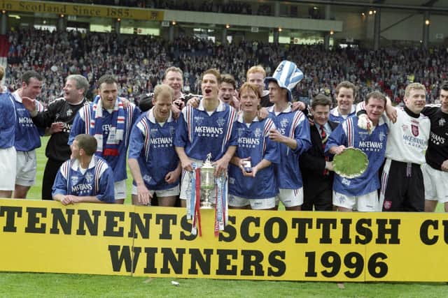 Rangers players celebrate winning the 1996 Scottish Cup.
