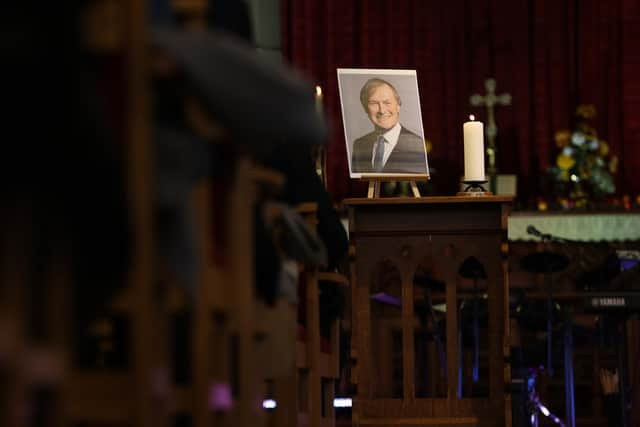 A picture of Sir David Amess stands at the front of the church during a service for the MP at St Michael and All Angels church (Photo by Hollie Adams/Getty Images)