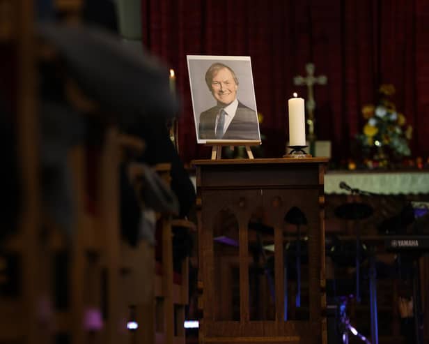 A picture of Sir David Amess stands at the front of the church during a service for the MP at St Michael and All Angels church (Photo by Hollie Adams/Getty Images)