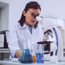 Scientist working with her microscope