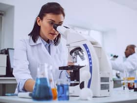 Scientist working with her microscope