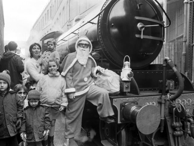 Children wait to board the Scottish Railway Preservation Society's 'Santa Special' steam train at Waverley Station, Edinburgh, in December 1988.