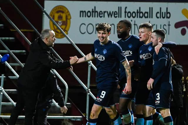 Morton's Robbie Muirhead (centre) celebrates making it 1-0 during the Scottish Cup 4th round match against Motherwell. (Photo by Paul Devlin / SNS Group)