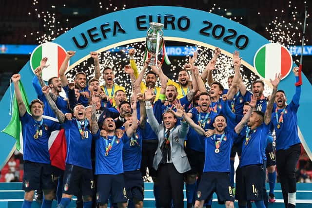 Italy celebrate lifting the European Championship trophy after victory over England at Wembley (Photo by MICHAEL REGAN/POOL/AFP via Getty Images)