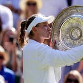 Wimbledon champion Elena Rybakina celebrates with the Venus Rosewater Dish.