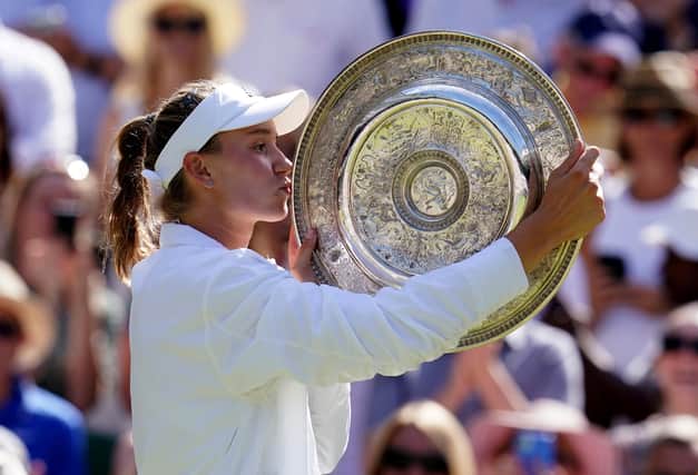 Wimbledon champion Elena Rybakina celebrates with the Venus Rosewater Dish.
