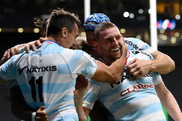 Racing's Argentinian left wing Juan Imhoff (L) celebrates with Finn Russell after the Scottish stand-off set up the winning try against Saracens.