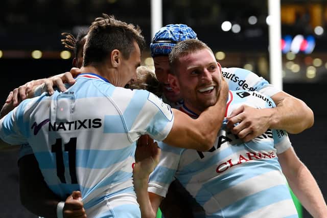 Racing's Argentinian left wing Juan Imhoff (L) celebrates with Finn Russell after the Scottish stand-off set up the winning try against Saracens.