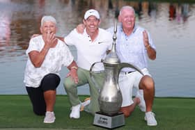 Rory McIlroy celebrates with his parents, Rosie and Gerry, after landing a record fourth win in the Hero Dubai Desert Classic at Emirates Golf Club. Picture: Warren Little/Getty Images.