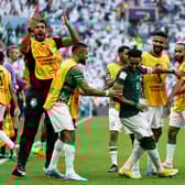 Saudi Arabia's Salem Al-Dawsari celebrates with team-mates after scoring the winning goal against Argentina.
