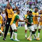 Saudi Arabia's Salem Al-Dawsari celebrates with team-mates after scoring the winning goal against Argentina.