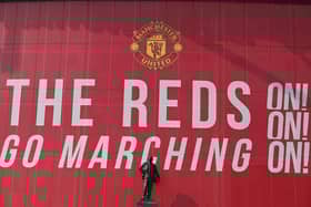 A statue of Matt Busby sits outside Manchester United's Old Trafford stadium in Manchester. British Prime Minister Boris Johnson will host a meeting of football chiefs and fans' representatives today as they consider what action to take over the proposed European Super League. Picture: Paul Ellis/AFP via Getty Images