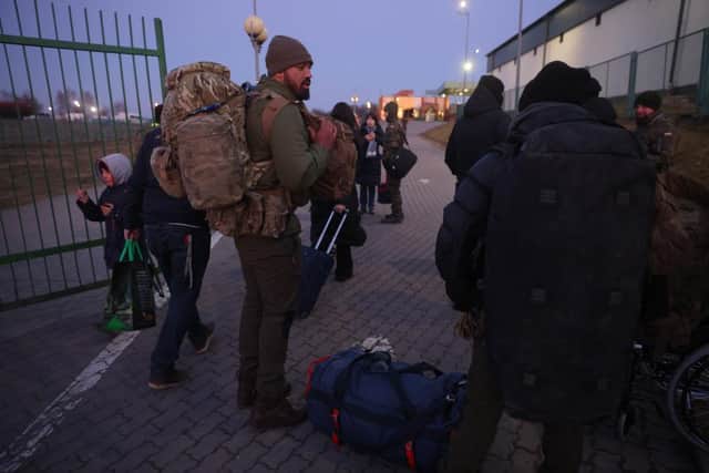 Two men from London prepare to cross into Ukraine at the Medyka border crossing in Poland. In a report issued by the Ukrainian army stating the creation of a foreign legion unit for international volunteers, Ukraine's President Zelensky appealed to foreign nationals to join his army in the fight against Russia.