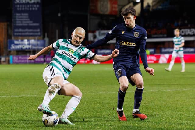 Daizen Maeda (left) of Celtic in action against Owen Beck of Dundee during the last clash between the two teams at Dens Park.