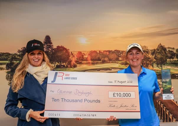 Gemma Dryburgh, right, after receiving the trophy and her £10,000 cheque from Kate Rose following the Scot's play-off victory at JCB Golf & Country Club in Uttoxeter. Picture: Rose Ladies Series