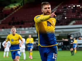 St Johnstone's Shaun Rooney celebrates making it 1-0 during his side's dramatic penalty shoot-out win over Dunfermline Athletic (Photo by Ross Parker / SNS Group)