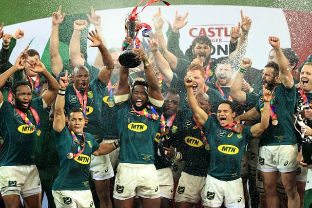 Siya Kolisi, the South Africa captain, raises the trophy as his team celebrate their series victory over the Lions. Picture: David Rogers/Getty Images