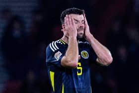 Scotland's Grant Hanley looks dejected at full time after the 3-2 defeat to Poland at Hampden. (Photo by Craig Williamson / SNS Group)
