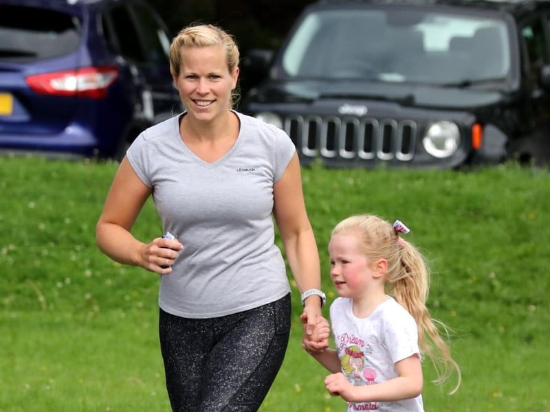 A young runner gets a helping hand around the Waterlooville junior parkrun course. Picture: Sam Stephenson