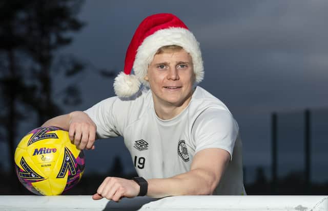 Hearts defender Alex Cochrane gets in the festive spirit ahead of the Christmas Eve trip to Dundee United.  (Photo by Mark Scates / SNS Group)