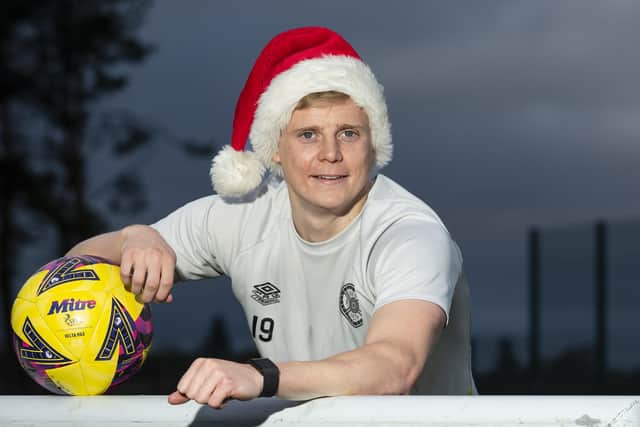 Hearts defender Alex Cochrane gets in the festive spirit ahead of the Christmas Eve trip to Dundee United. (Photo by Mark Scates / SNS Group)