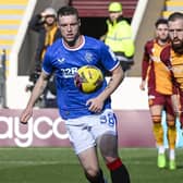 Rangers' Leon King was booked for a tackle on Motherwell's Stuart McKinstry.