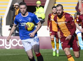 Rangers' Leon King was booked for a tackle on Motherwell's Stuart McKinstry.