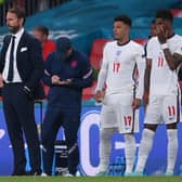 England manager Gareth Southgate brought both Jadon Sancho (L) and Marcus Rashford on in the last minute of extra-time. Both failed to score their penalties.  (Photo by LAURENCE GRIFFITHS/POOL/AFP via Getty Images)