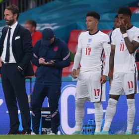 England manager Gareth Southgate brought both Jadon Sancho (L) and Marcus Rashford on in the last minute of extra-time. Both failed to score their penalties.  (Photo by LAURENCE GRIFFITHS/POOL/AFP via Getty Images)