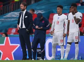England manager Gareth Southgate brought both Jadon Sancho (L) and Marcus Rashford on in the last minute of extra-time. Both failed to score their penalties.  (Photo by LAURENCE GRIFFITHS/POOL/AFP via Getty Images)