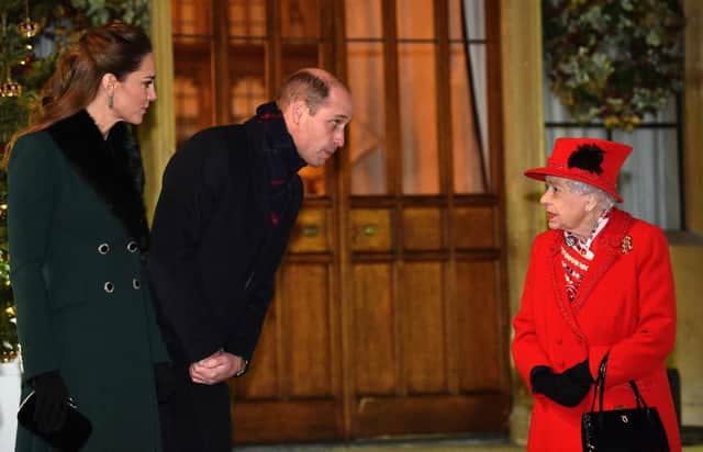 Queen Elizabeth II talks with the Duke and Duchess of Cambridge in the quadrangle at Windsor Castle to meet and thank members of the Salvation Army and local volunteers and key workers from organisations and charities in Berkshire, for the work they are doing to help others during the pandemic and over Christmas (photo: Glyn Kirk/PA Wire).