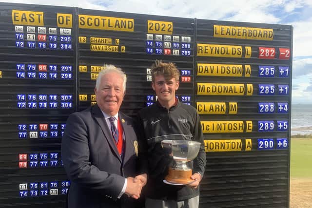 University of Stirling golf scholar Lachlan Reynolds is presented with the East of Scotland Open Trophy by Lundin Golf Club captain John Baxter. Picture: East of Scotland Open