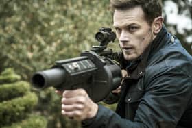 Sam Heughan as Tom Buckingham in SAS: Red Notice.