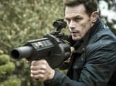 Sam Heughan as Tom Buckingham in SAS: Red Notice.