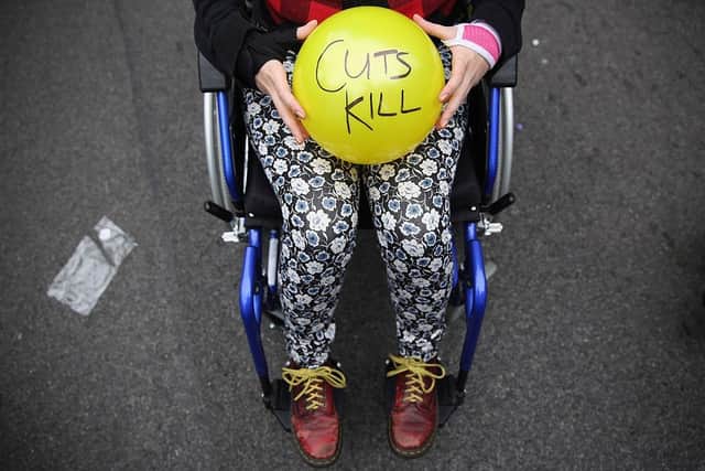 Anti austerity protesters prepare to throw balls towards Downing Street after the Chancellor of the Exchequer George Osborne left 11 Downing Street on July 8, 2015 in London, England.  Photo by Dan Kitwood/Getty Images