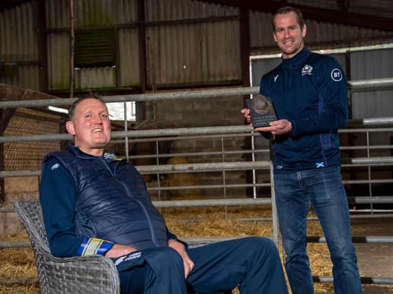 Doddie Weir is presented with a sculpted memento by Chris Paterson to mark his induction into the Scottish Rugby Hall of Fame. Picture: Bill Murray/SNS