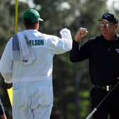 Phil Mickelson fist bumps his caddie, brother Tim, on the 18th green during the final round of the 2023 Masters. Picture: Patrick Smith/Getty Images.