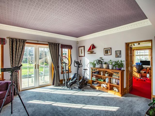 Family room with door through to office.