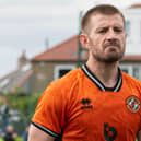 Dundee United's Ross Docherty looks dejected at full time following the surprise 1-0 defeat by Spartans.