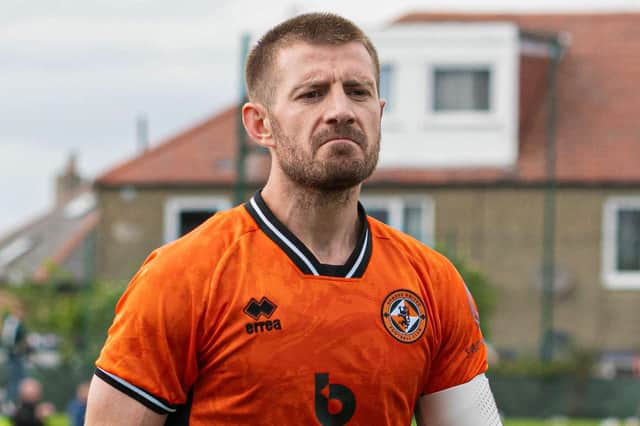 Dundee United's Ross Docherty looks dejected at full time following the surprise 1-0 defeat by Spartans.
