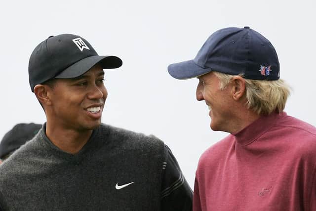 Tiger Woods and Greg Norman share a joke during the 133rd Open Championship at Royal Troon. Picture: Ross Kinnaird/Getty Images.