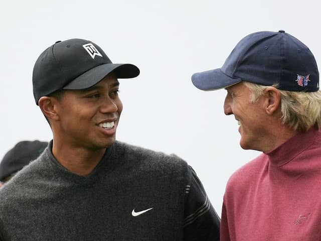 Tiger Woods and Greg Norman share a joke during the 133rd Open Championship at Royal Troon. Picture: Ross Kinnaird/Getty Images.