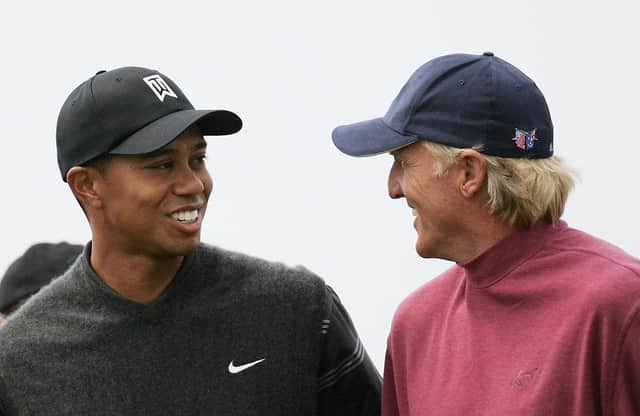 Tiger Woods and Greg Norman share a joke during the 133rd Open Championship at Royal Troon. Picture: Ross Kinnaird/Getty Images.