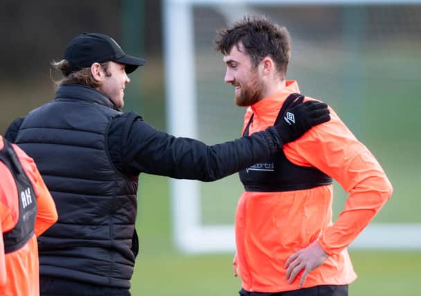 Hearts manager Robbie Neilson welcomes defender John Souttar back to training after his Scotland heroics  (Photo by Mark Scates / SNS Group)